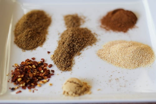 Spices on a plate to be used in the tagine.