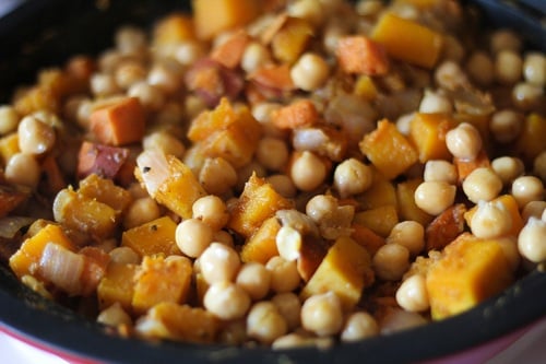 Tagine with sweet potatoes, onions, spices, and chickpeas.