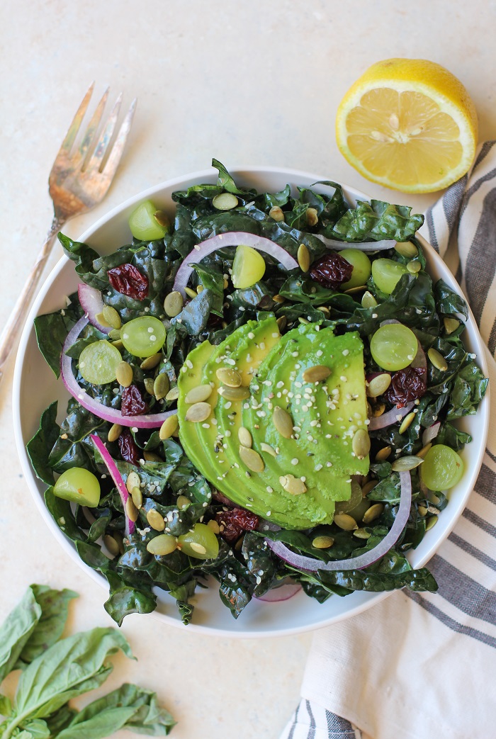 Lemon Basil Kale Salad with grapes, pumpkin seeds, and avocado | TheRoastedRoot.net #healthy #salad #recipe #detox #vegan #vegetarian