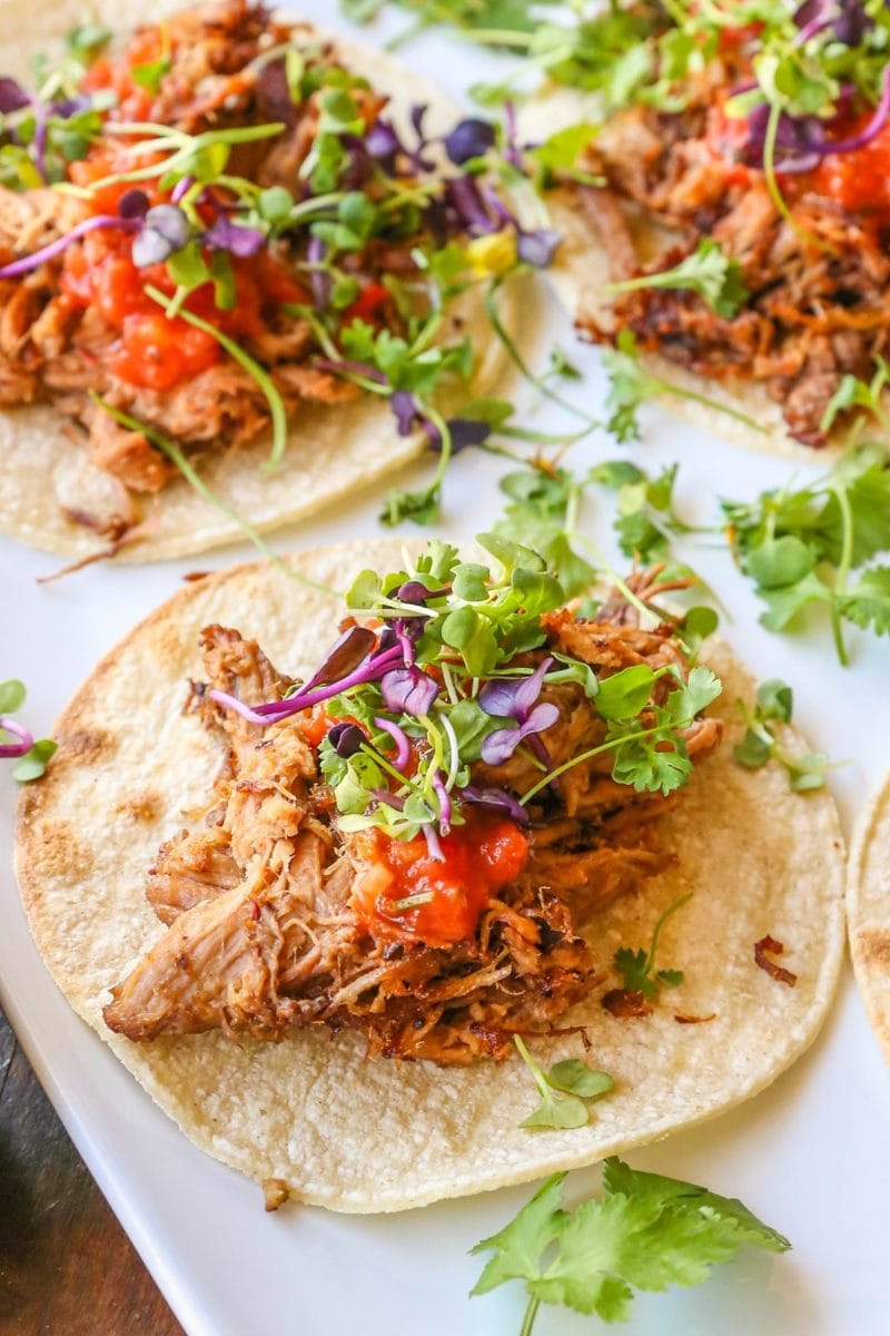 White platter of barbacoa beef tacos