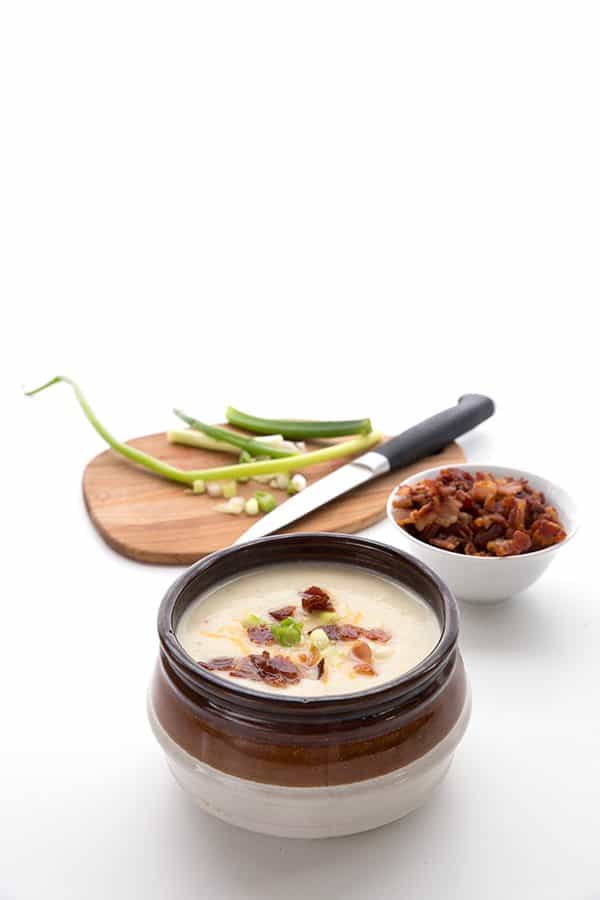 Instant Pot Loaded Cauliflower Soup from All Day I Dream About Food - This creamy cauliflower soup is rich and satisfying, and it takes only a few short minutes to make in your Instant Pot! Low carb comfort food at its finest.ย