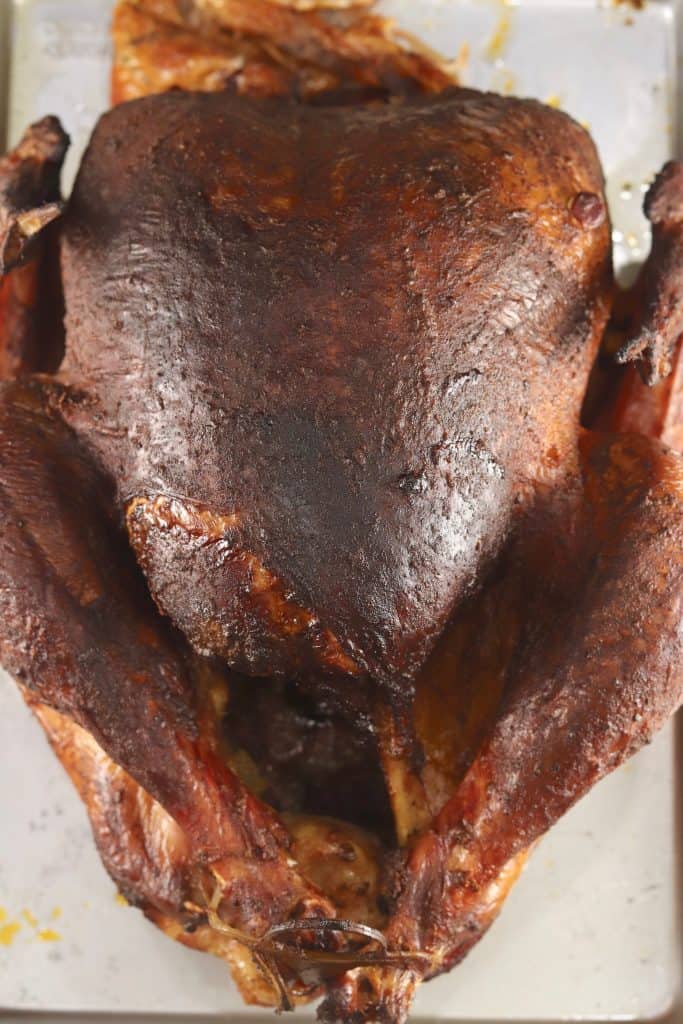 Cajun Smoked Turkey from Out Grillingย is loaded with flavor. A great addition to any holiday meal or great to make ahead for sandwiches. Easy to make at home and so much tastier than what you will find at the deli.