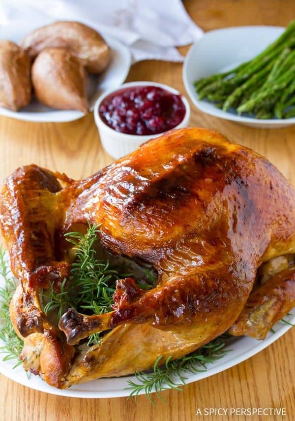Cranberry Jalapeno Honey Baked Turkey from A Spicy Perspective ย A sweet and spicy approach to your holiday meal! The most amazing turkey brine and glaze recipe, that produces a golden glistening juicy turkey with a crispy crust!