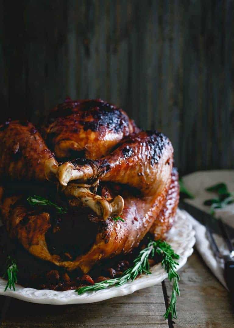 Tart Cherry Cranberry Glazed Turkey from Running to the Kitchen - A changeup from the ye old classic flavors, this recipe is ultra enticing and a unique Thanksgiving turkey recipe! The slightly sweet and sticky glaze gives the bird tons of festive flavor!ย