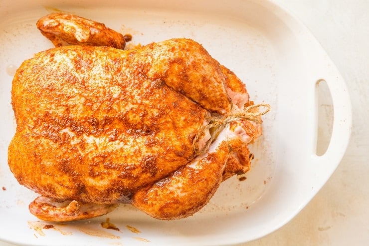 Rub the chicken marinade all over the whole chicken