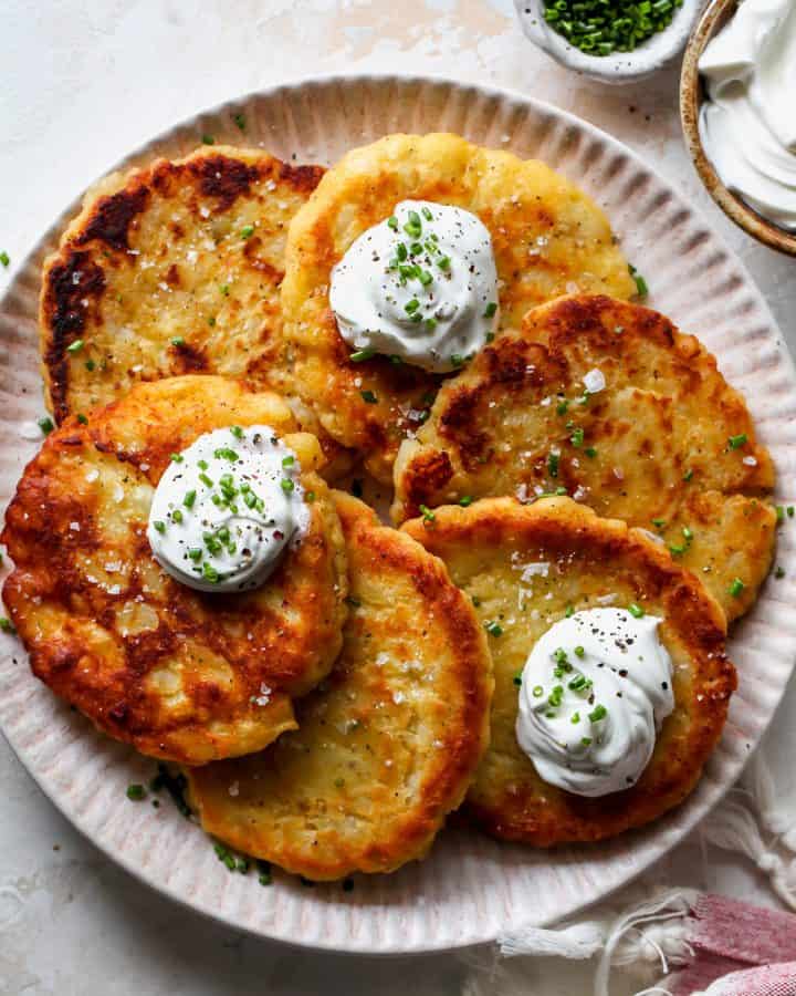 These potato pancakes are delicious and easy to make with or without leftover mashed potatoes! It only takes 8 ingredients to make the best potato pancakes!ย