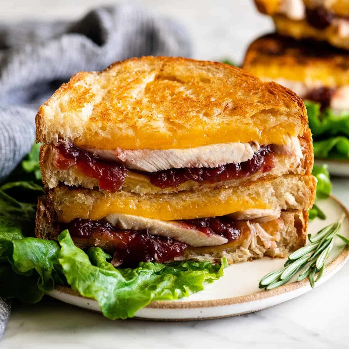 Leftover Turkey Cranberry Sandwich In this Turkey Cranberry Sandwich recipe turkey and cranberry sauce are nestled between two slices of buttery bread that have been grilled to perfection, all held together by melted cheddar cheese. This Thanksgiving sandwich is the perfect way to use up leftover turkey!ย