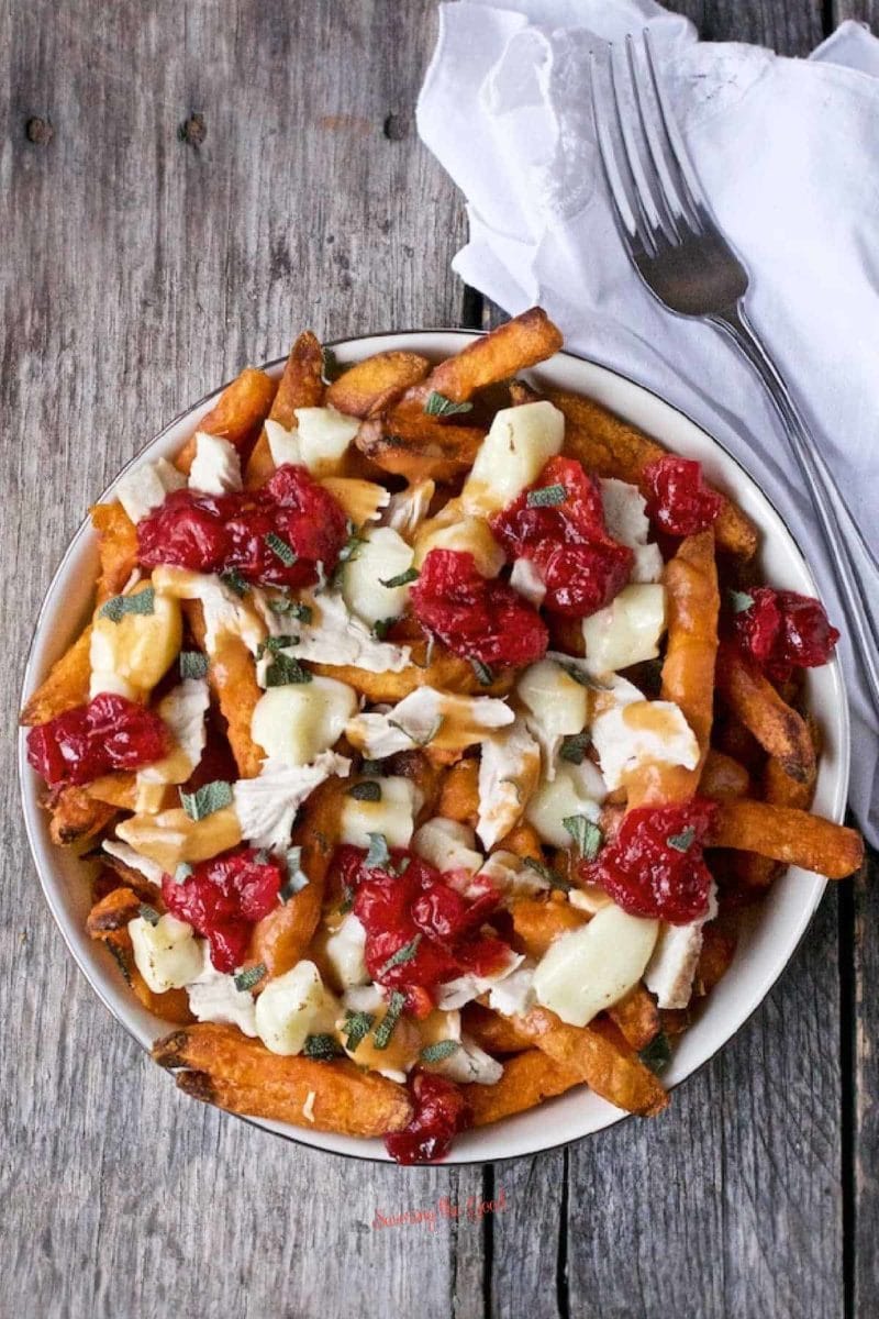 Turkey Poutine from Savoring the Goodย - Use leftover turkey, gravy, and cranberry sauce as a way to load up your sweet potato fries for an incredible meal.