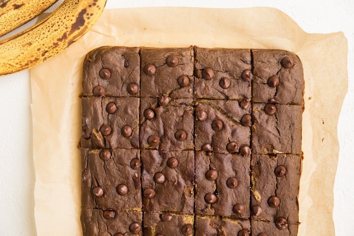 Sliced chickpea bars on parchment paper.