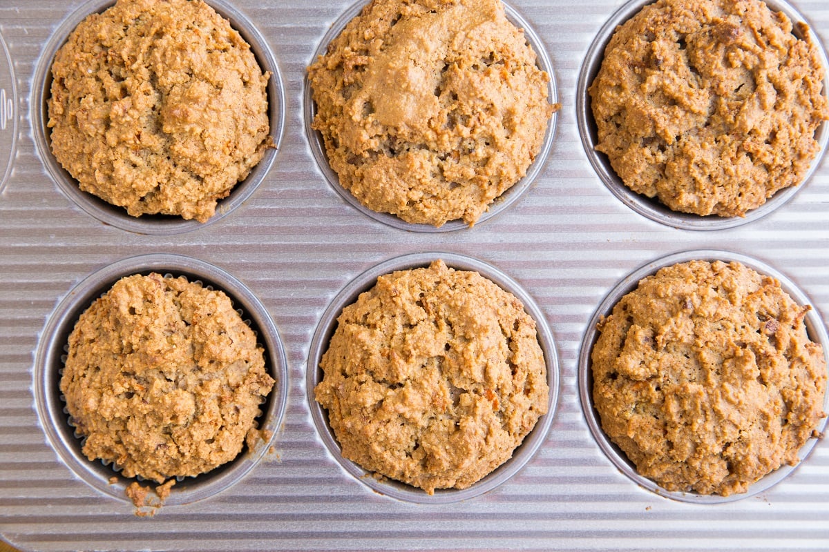 Carrot muffins fresh out of the oven in an oven tray