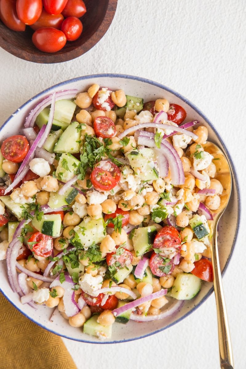 Big bowl of chickpea salad with fresh vegetables