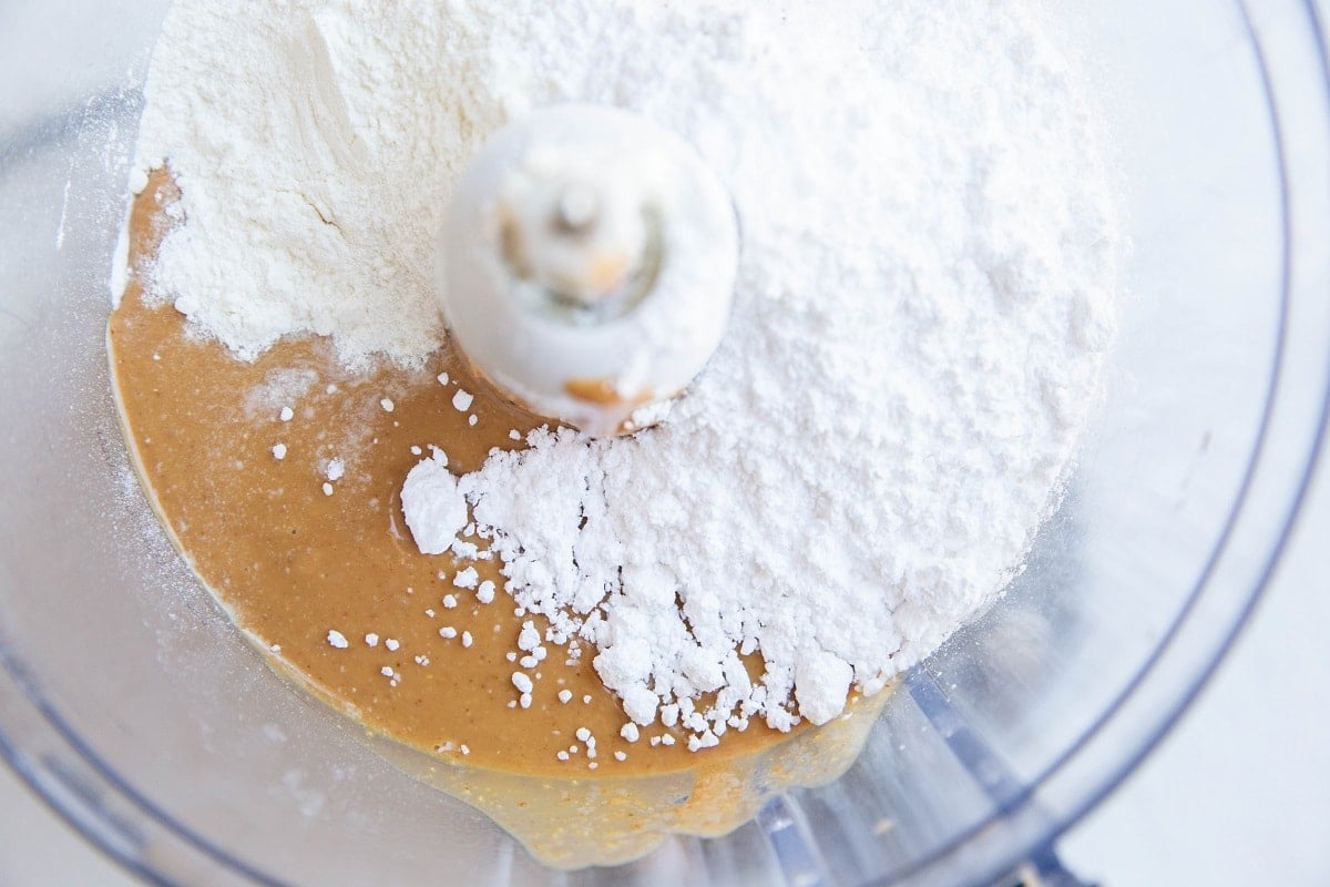 Ingredients for no-bake protein balls in a food processor