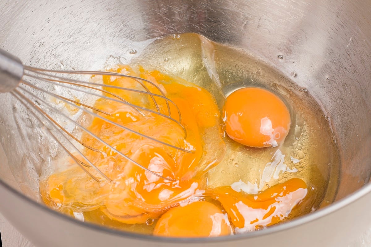 Whisking eggs in a mixing bowl