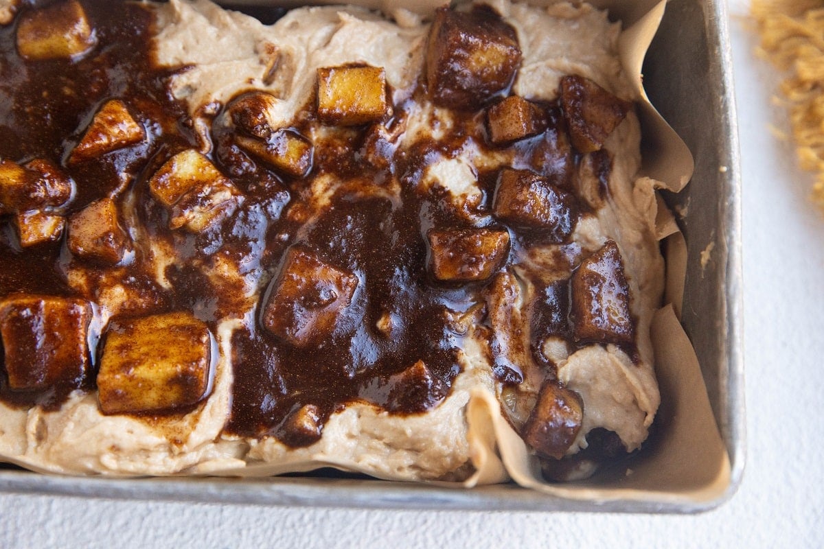 Apple bread dough with apple cinnamon on top, ready to go into the oven.