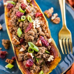 Stuffed Delicata Squash with Ground Beef, Cranberries and Pecans is a healthy dinner recipe that is paleo, whole30 and nutritious. Plus, it's easy to make!