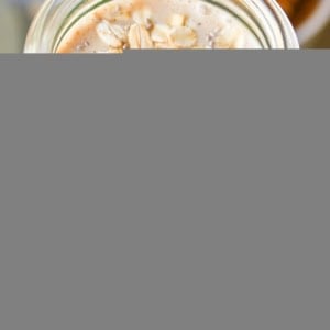 Almond Butter Protein Smoothie with chia seeds, banana, and oats in a glass, ready to drink