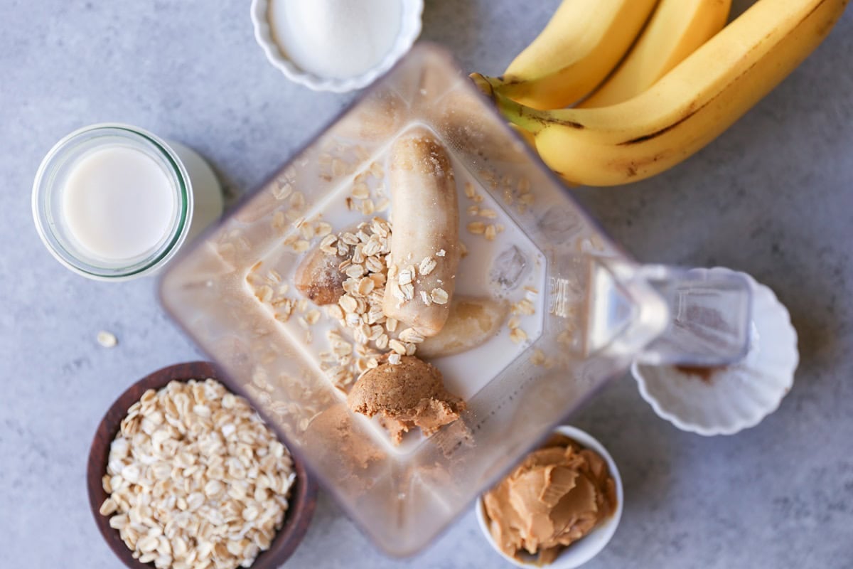 Ingredients for almond butter chia smoothie in a high powered blender, ready to blend.