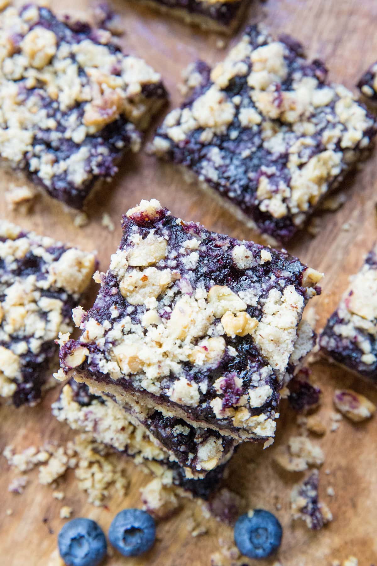 Blueberry crumb bars stacked on top of each other.