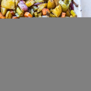 Balsamic roasted vegetables in a white casserole dish, fresh out of the oven and ready to serve.