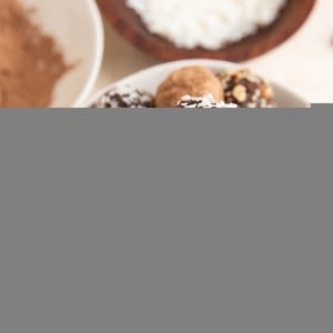 Healthy chocolate truffles in a white bowl, ready to serve.