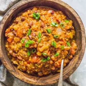 Wooden bowl full of pumpkin chili