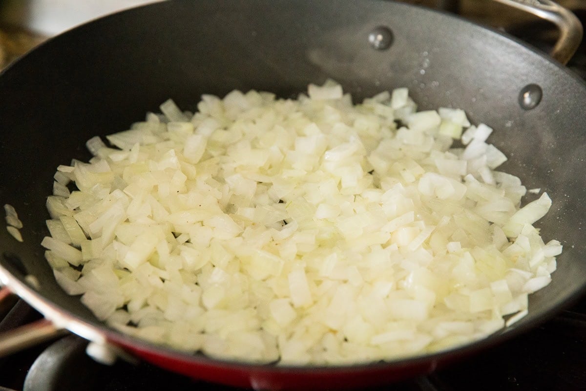 Sautéed onions in a skillet.