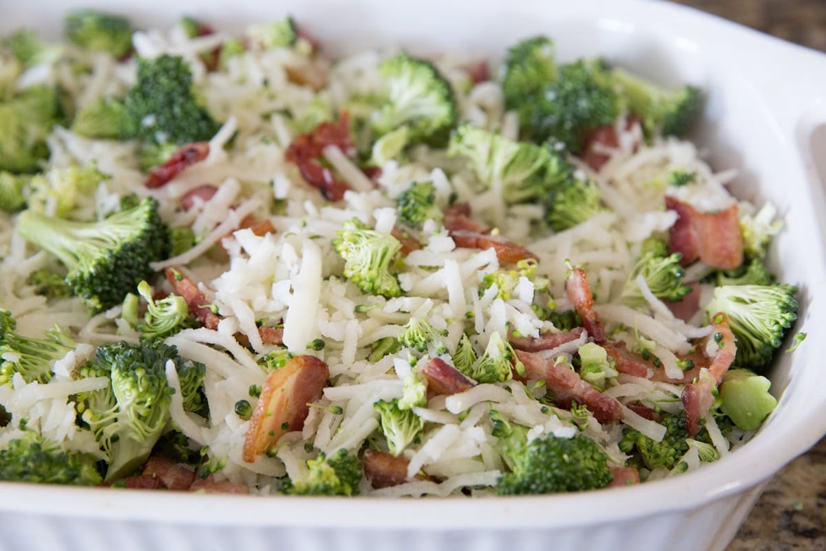 hashbrowns, broccoli, cooked bacon in a large casserole dish, mixed up.