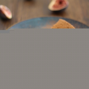 Gluten Free Chocolate Fig Cake on a blue plate with a fork taking a bite out.