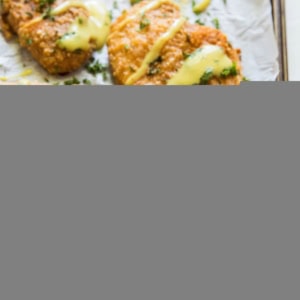 Grain-Free Pretzel-Crusted Baked Chicken - a healthier take on crispy chicken on a baking sheet fresh out of the oven.