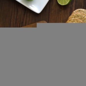 Cured salmon on crackers with fresh dill and capers, ready to serve.