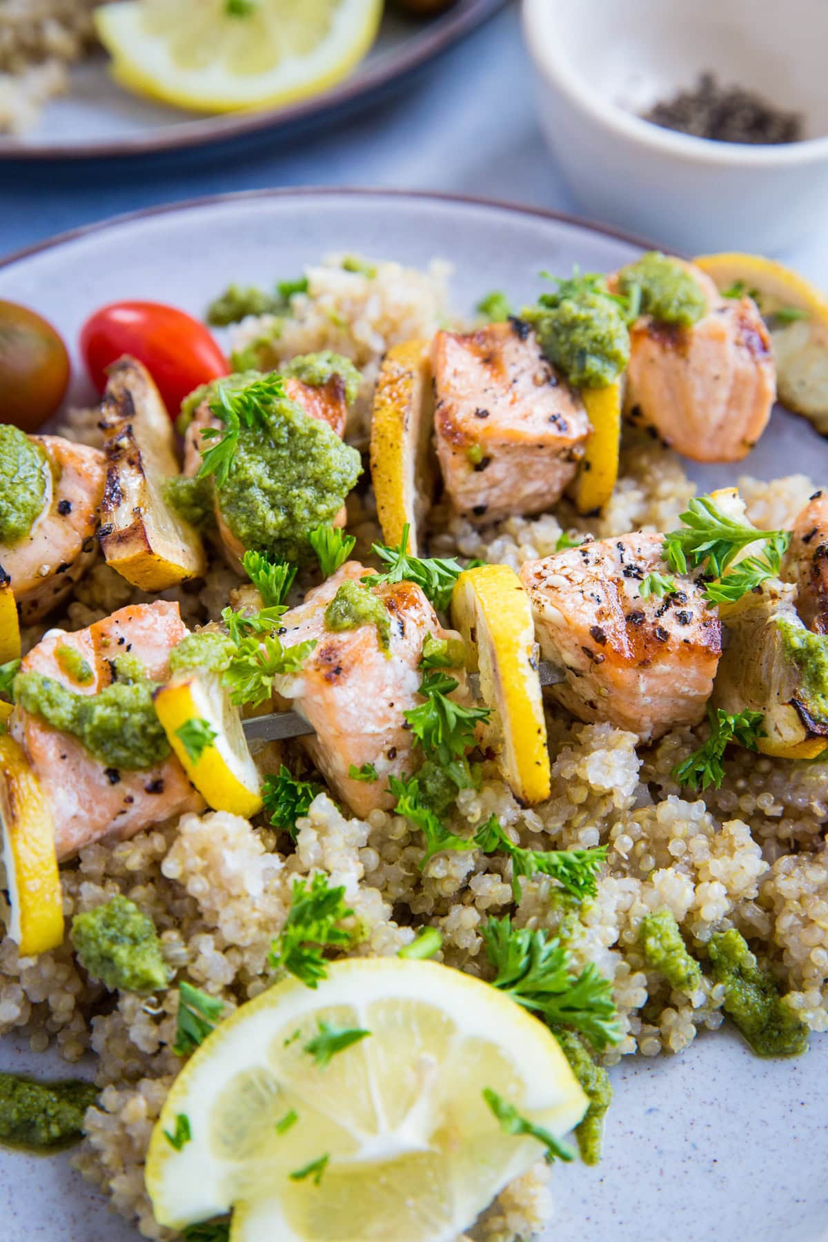 Grilled Salmon Kabobs with pesto sauce and quinoa - a quick, easy, nutritious meal | TheRoastedRoot.com #glutenfree #paleo #primal #healthy