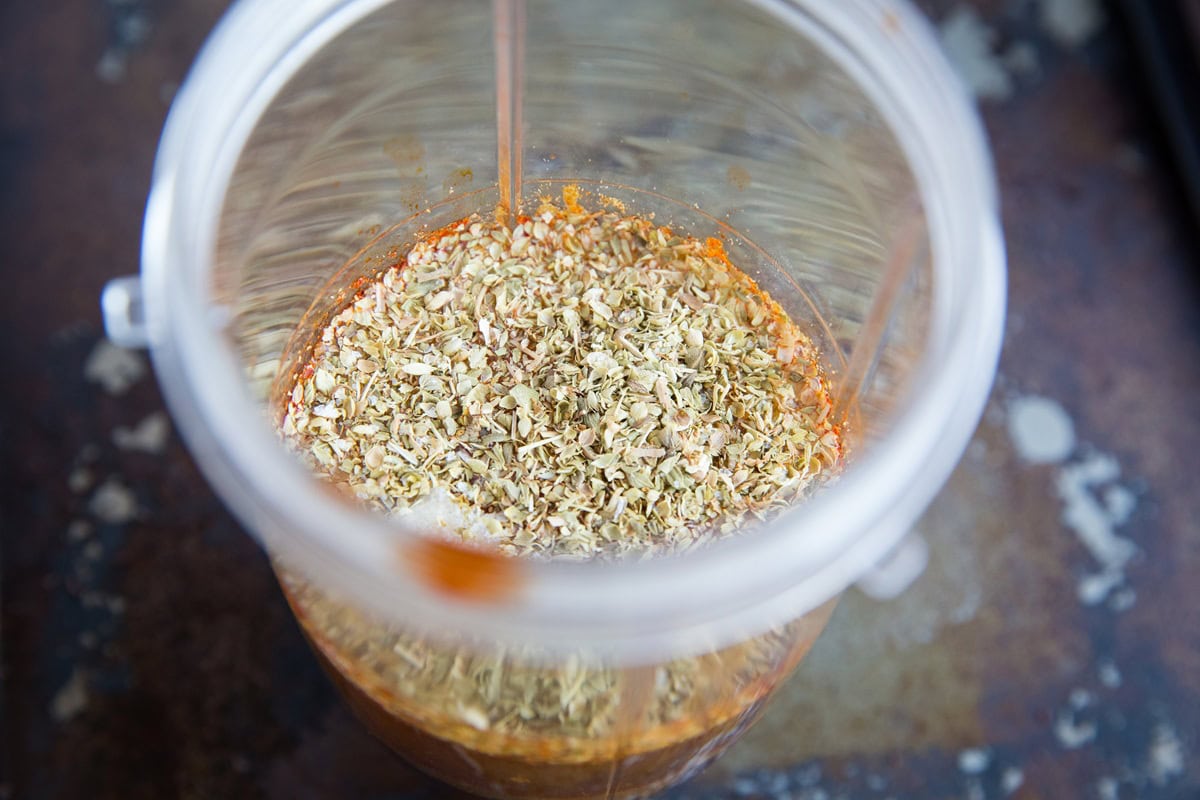 adobo sauce ingredients for barbacoa beef in a small blender, waiting to be blended.