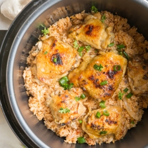 Instant Pot Spanish Rice with Chicken garnished with chopped green onion.