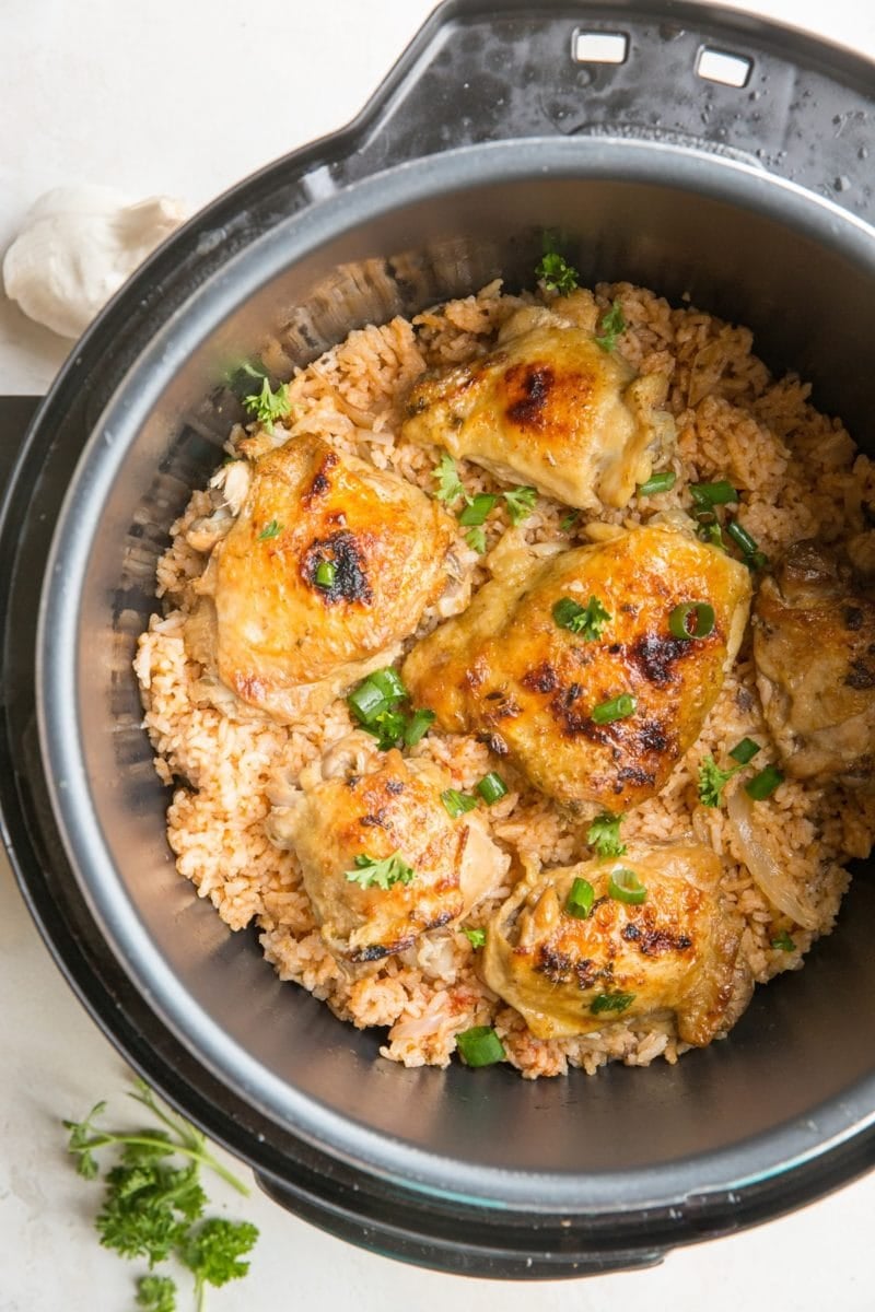 Instant Pot Spanish Rice with Chicken garnished with chopped green onion.