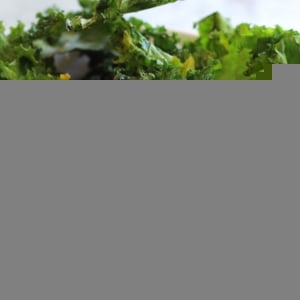 Baked Kale Chips in a ramekin, ready to serve.