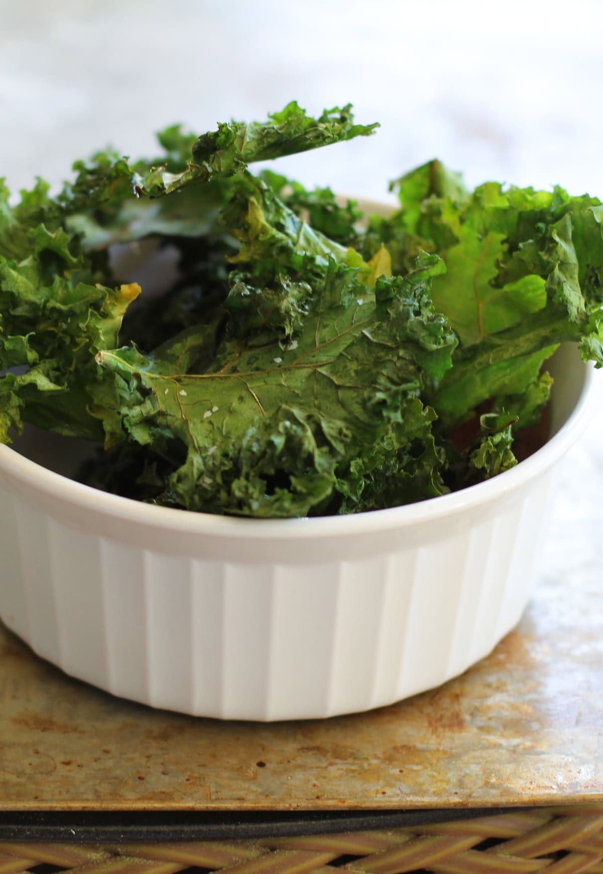 Baked Kale Chips in a ramekin, ready to serve.