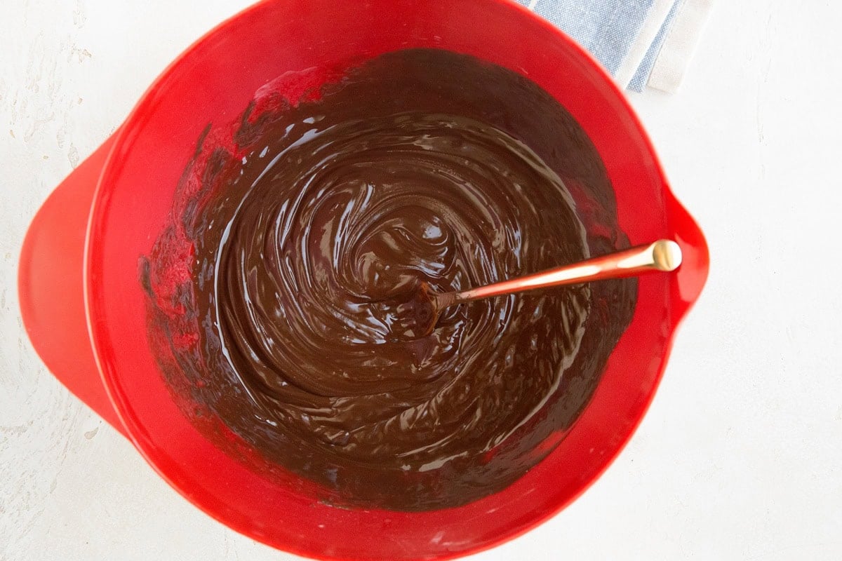 Chocolate ganache layer for peanut butter bars in a mixing bowl