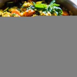 Large stainless steel skillet full of Thai ground turkey curry.