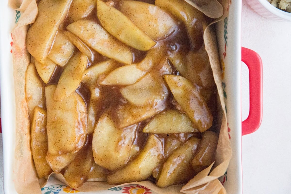 Layer the cooked apples on top of the crust