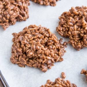 Chocolate peanut butter no bake rice crispy cookies on a baking sheet. Ready to eat!