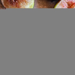 Roasted figs on a baking sheet fresh out of the oven and juicy.