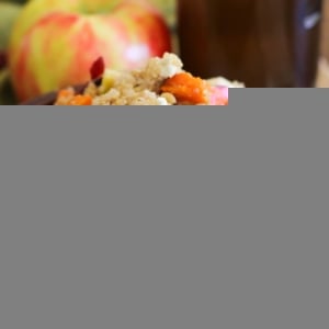 Large wooden bowl full of sweet potato quinoa salad