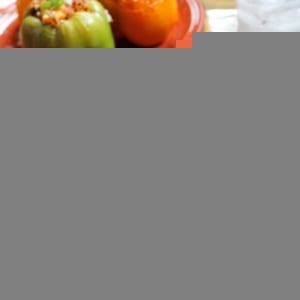 Stuffed bell peppers on a plate, cut in half