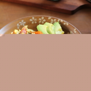 Bowl full of sweet potato, bacon and spinach scramble.
