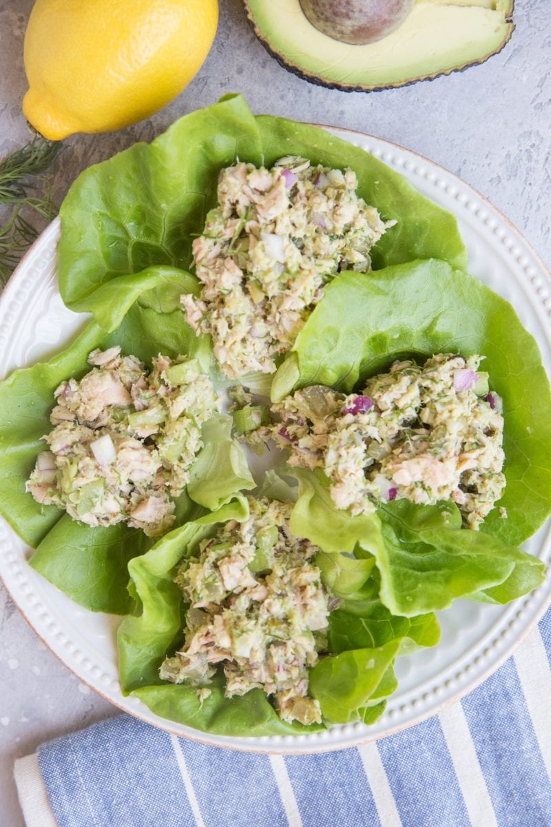 Tuna Lettuce Wraps on a white plate with a blue stripe napkin to the side. Ready to eat.