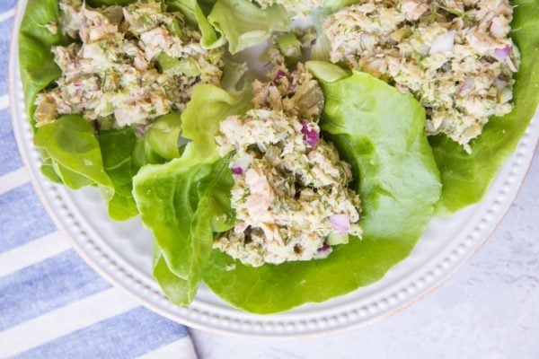 White plate with three lettuce wraps with tuna salad. Ready to enjoy for lunch.