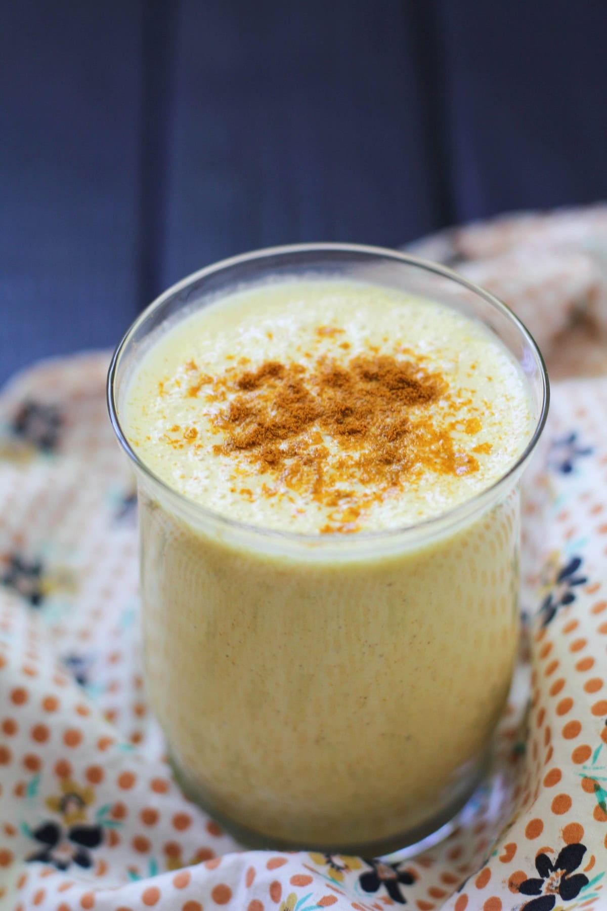 Glass of turmeric lassi with a napkin