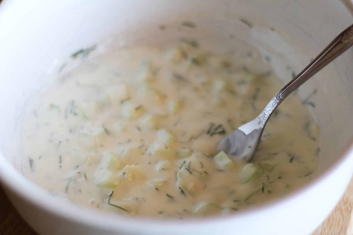 Bowl of Tzatziki sauce all mixed up in a bowl.