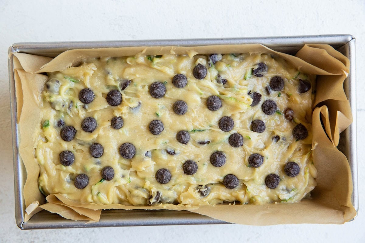 Zucchini bread batter in a loaf pan, ready to bake.