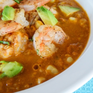 Smokey corn chowder with shrimp and avocado on top.